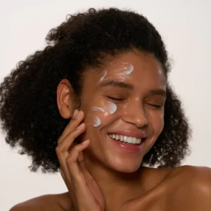black woman happy with AXIS-Y Heartleaf My Type Calming Cream